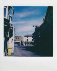tiny polaroid of a quiet street